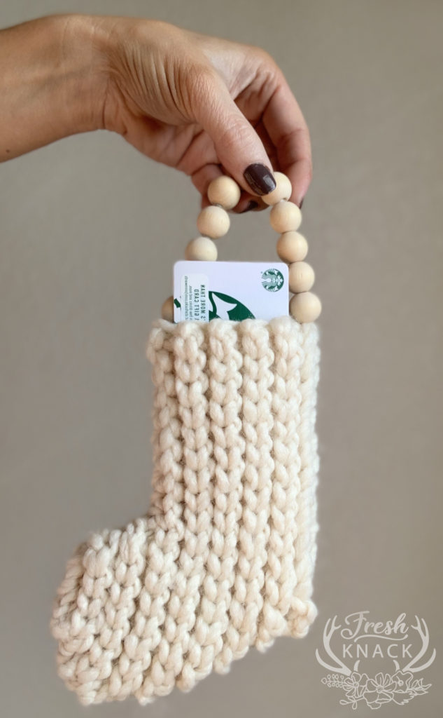 The easy crochet mini stocking can be a great gift card holder.